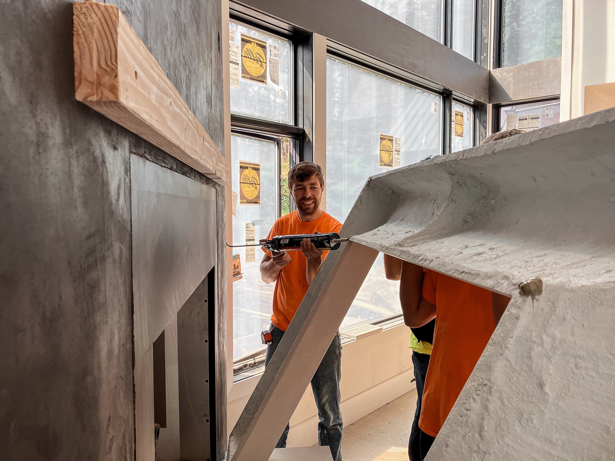Cast stone fireplace installation in progress — article thumbnail for 'How to Install a Cast Stone Fireplace'